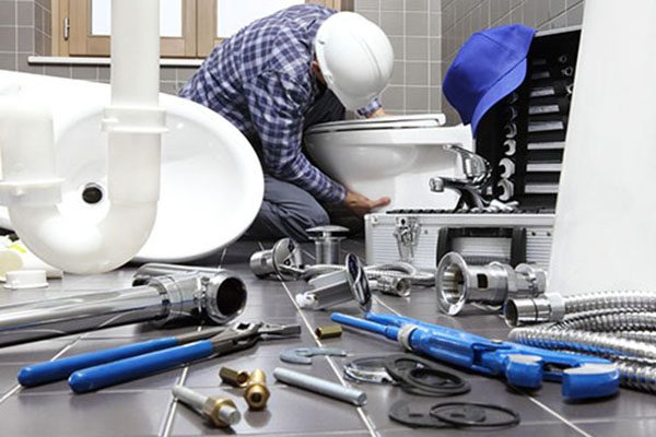 stock-photo-plumber-at-work-in-a-bathroom-plumbing-repair-service-assemble-and-install-concept-1066126067-transformed